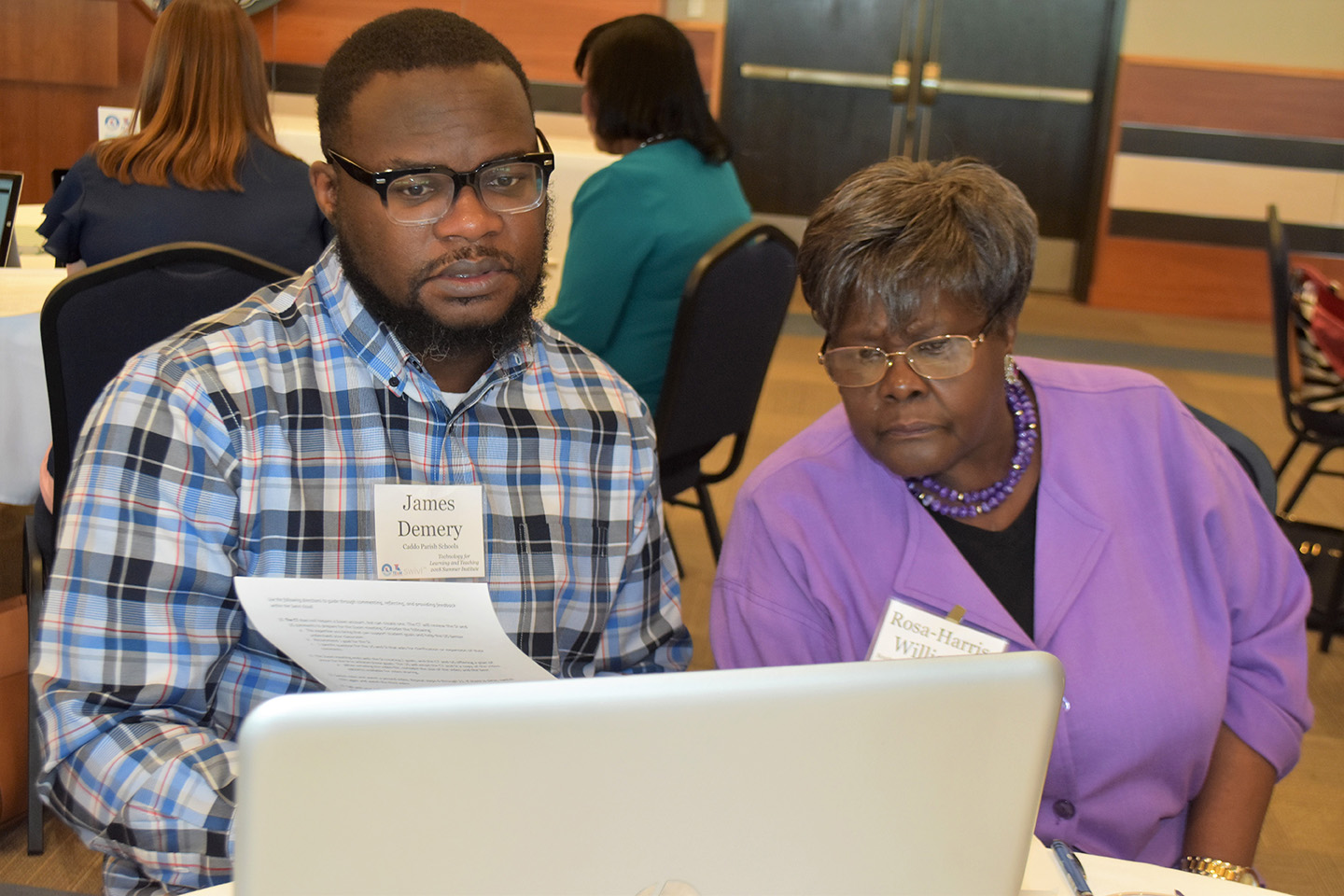DSC_0212 Teachers engage with technology to benefit their classes during a College of Education workshop.